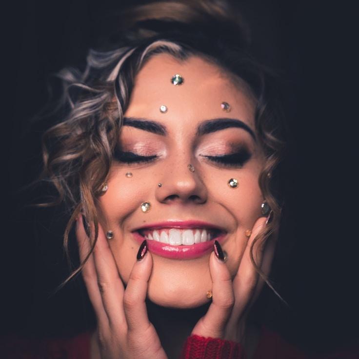 Avery Chen, Lead Design Curator at ClaspBeamStudio, reviewing corporate floral arrangements